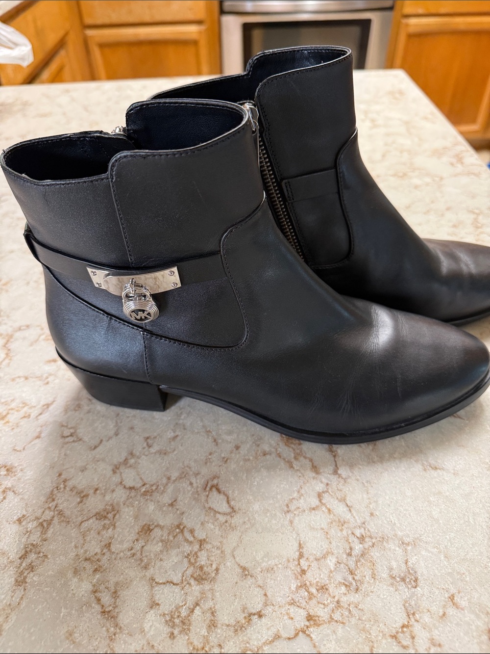 Michael Kors Black Leather Ankle Booties with Silver Logo Charm. Size 10